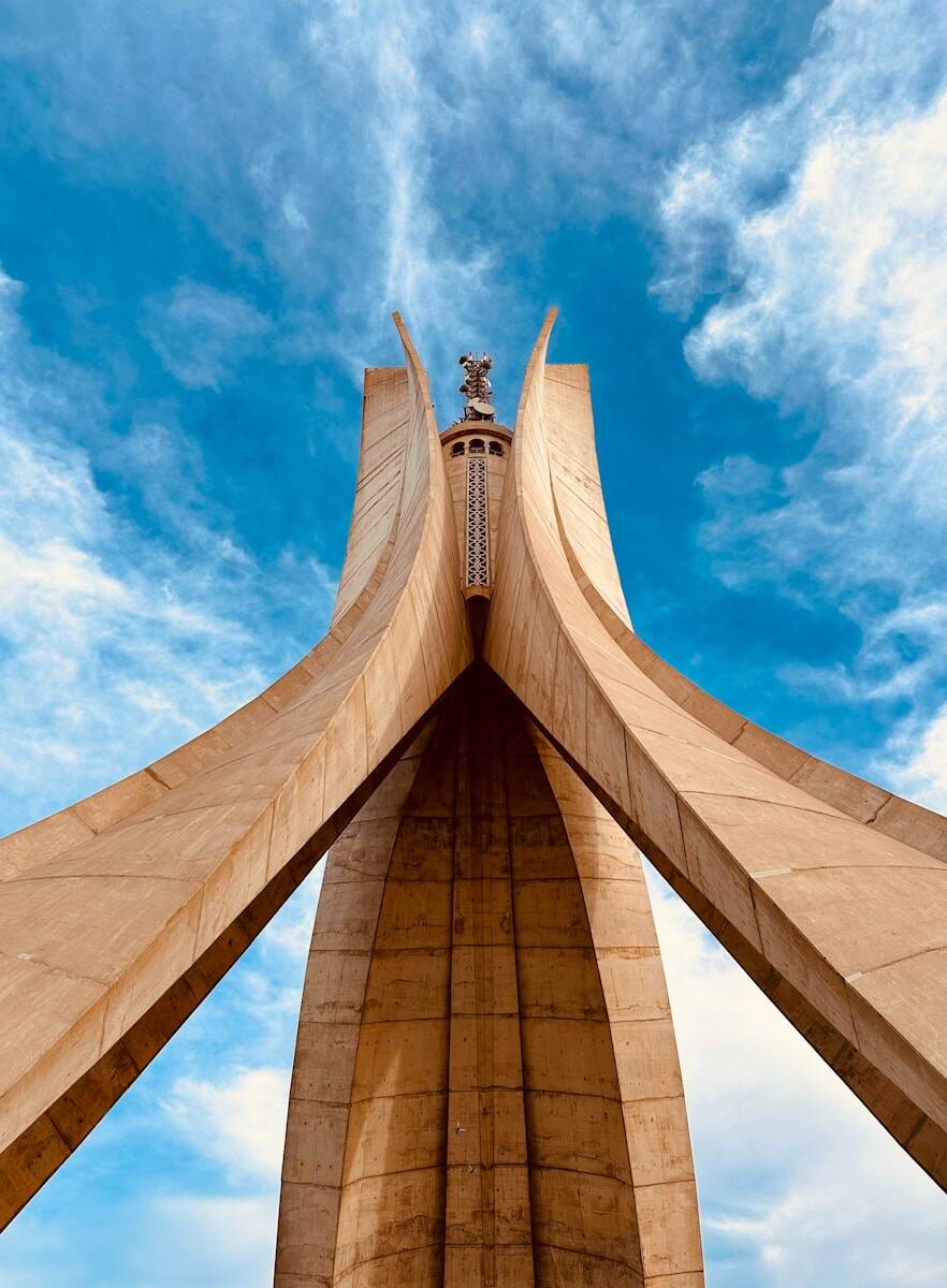 a very tall building with a sky background